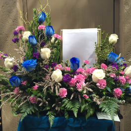 Picture or Urn arrangement with blue and white roses