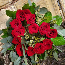 Bouquet of red roses with eucalyptus and greenery