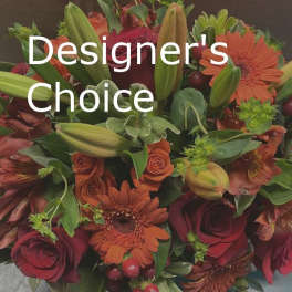 Mixed bouquet of red roses, orange gerberas, and lilies