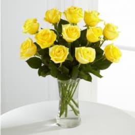 Bouquet of yellow roses in a clear glass vase