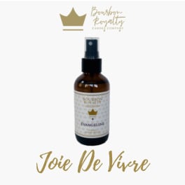 Amber spray bottle of Bourbon Royalty candle spray on a white background
