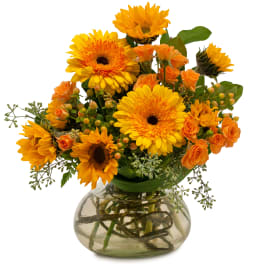 Orange and yellow bouquet in a clear glass vase