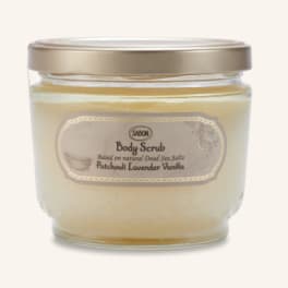 Jar of body scrub with a gold lid and beige label