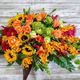 Bright mixed bouquet with roses, sunflowers, and orchids