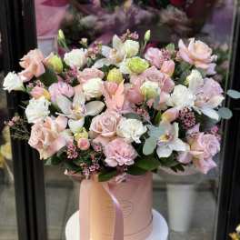 Blush and white bouquet in a pink hatbox with ribbon