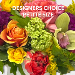 Colorful mixed bouquet with roses, orchids, and green filler