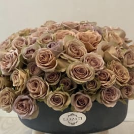 Round box arrangement of blush and beige roses
