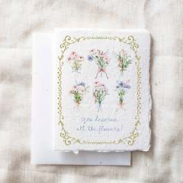 Decorative card with small illustrated flower bouquets and the words "you deserve all the flowers!"