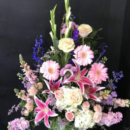 Tall mixed bouquet with pink lilies, roses, and gerbera daisies