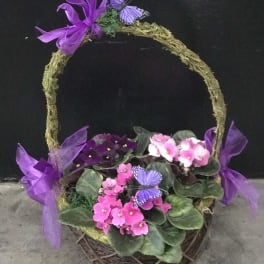 Basket planter with pink and purple flowers and ribbon bows