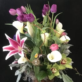Mixed bouquet with purple tulips, white calla lilies, and pink stargazer lily