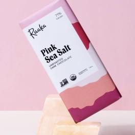 Pink sea salt dark chocolate bar on a pink background