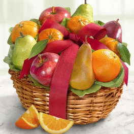 Fruit basket with apples, pears, oranges, and a red ribbon