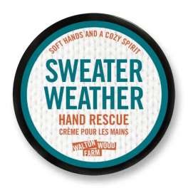 Round tin of hand cream labeled Sweater Weather