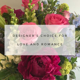 Mixed bouquet of pink and purple flowers with a "Love and Romance" label
