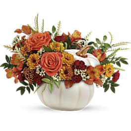 Autumn floral arrangement in a white pumpkin container