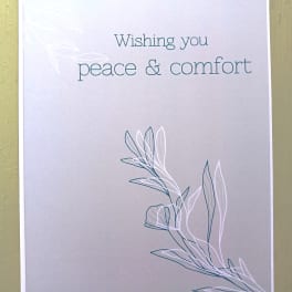 Sympathy greeting card with 'Wishing you peace & comfort' text and simple leaf line art on a soft gray background