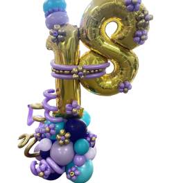 Gold balloon number 18 decorated with purple and blue balloons