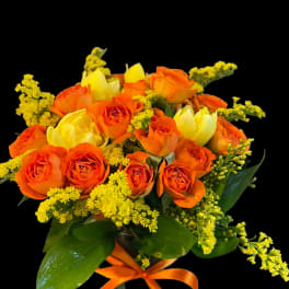 Orange and yellow rose bouquet tied with an orange ribbon