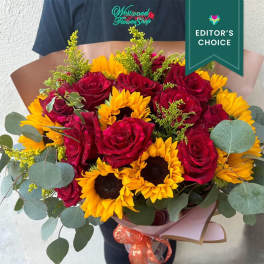 Bouquet of red roses and yellow sunflowers with eucalyptus