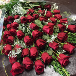 Bouquet of red roses with baby's breath and greenery