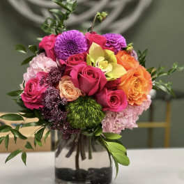 Colorful mixed bouquet in a clear glass vase