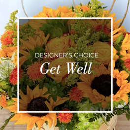 Bouquet of yellow sunflowers and orange blooms with green filler