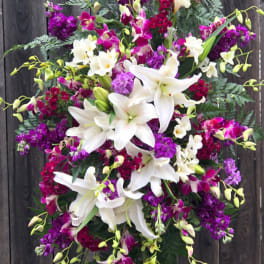 Standing floral spray with white lilies and purple orchids