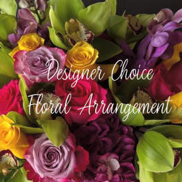 Mixed bouquet of roses and orchids in pink, yellow, and purple
