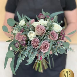 Hand-tied bouquet of blush and white roses with eucalyptus