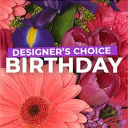 Bright mixed bouquet with pink gerbera daisy, purple iris, and pink blooms with birthday text overlay
