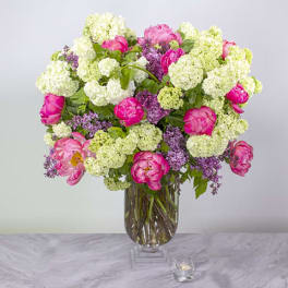 Pink and white mixed bouquet in a clear glass vase