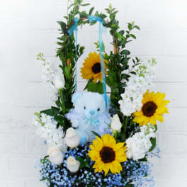 Sunflower and white rose arrangement with a blue teddy bear in a wooden box