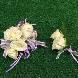 White rose bouquet and matching boutonniere with lavender ribbon