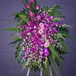 Standing floral spray with pink roses and purple orchids