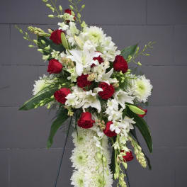 Standing floral spray with red roses, white lilies, and white chrysanthemums