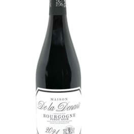 Bottle of red wine with a white label