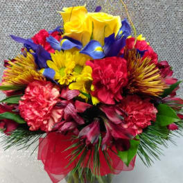 Colorful bouquet of mixed flowers in a glass vase