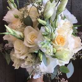 Bouquet of white roses and pale lisianthus with eucalyptus