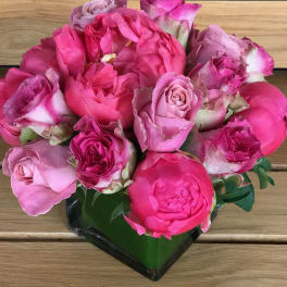 Bouquet of pink roses in a black wrap