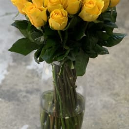 Bouquet of yellow roses in a clear glass vase