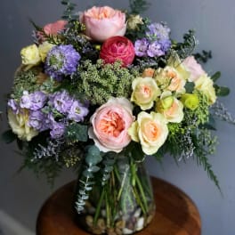 Mixed pastel bouquet in a glass vase