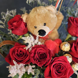 Red roses with a teddy bear and Ferrero Rocher chocolates