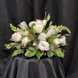 White rose and lisianthus bouquet with green accents