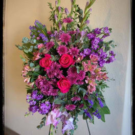 Tall standing floral spray with pink and purple flowers