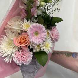 Pink and white mixed bouquet with roses, gerbera daisies, and carnations