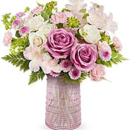 Pink and white bouquet in a textured vase