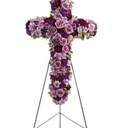 Purple floral cross on a stand