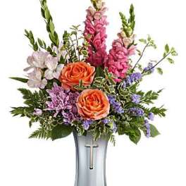 Mixed bouquet with orange roses and purple flowers in a silver vase