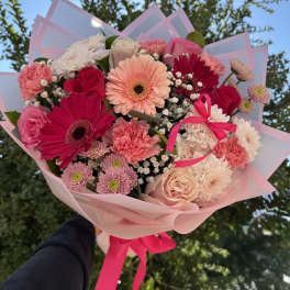 Pink and white mixed bouquet with gerbera daisies, roses, and carnations